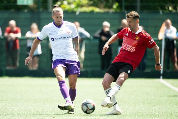 Football at Springfield.  Jersey Bulls select XI (white) V Manchester United Legends side (red). L>R JP Martyn and Danny Pugh                Picture: ROB CURRIE