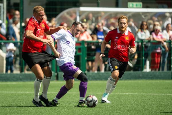 Football at Springfield.  Jersey Bulls select XI (white) V Manchester United Legends side (red). L>R Wes Brown and Chris Andrews                 Picture: ROB CURRIE