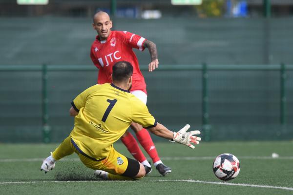 Karl Hinds passing keeper Welber Siva Sobrinho (first goal) Football Jersey Bulls v Corinthian Casuals Picture: DAVID FERGUSON