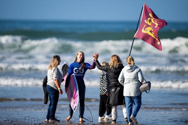 Surfing at St Ouen. GB Cup competition. Women's Open Round 4. A Channel Island competitor gets a high five as she leaves the water (heat 16)                      Picture: ROB CURRIE