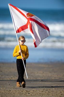 Surfing at St Ouen. GB Cup competition. A Jersey supporter                     Picture: ROB CURRIE