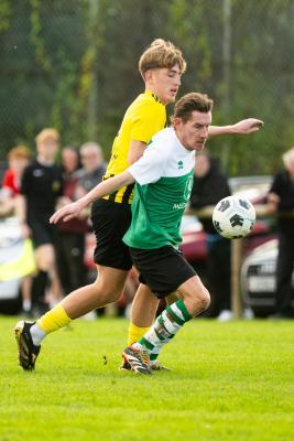 Football at IJB Field, St Saviour. Sporting Academics (green) V St Pauls (yellow). L>R  Callum Gilroy and  Ben Blacker                    Picture: ROB CURRIE