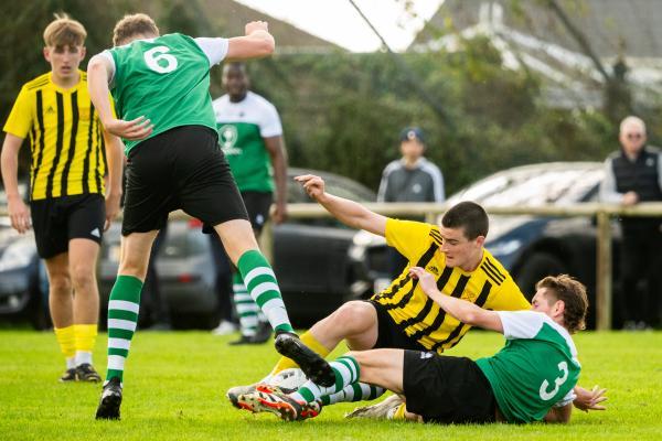 Football at IJB Field, St Saviour. Sporting Academics (green) V St Pauls (yellow). L>R  William Harris, Stanley Dunne and Ben Blacker                    Picture: ROB CURRIE