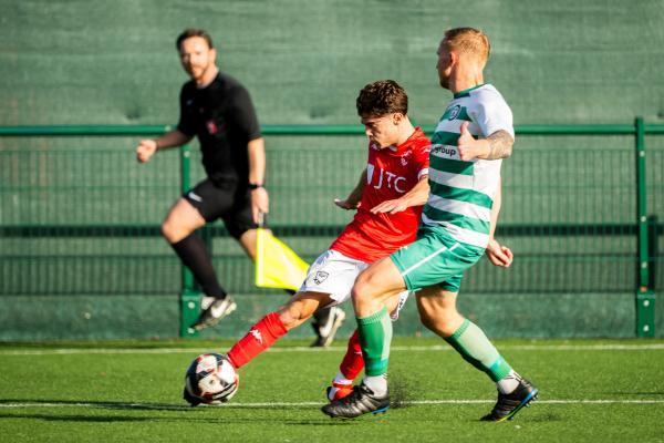 Football at Springfield. Chipstead (green) V Jersey Bulls (red). L>R Miguel Carvalho and Jake Hill                       Picture: ROB CURRIE