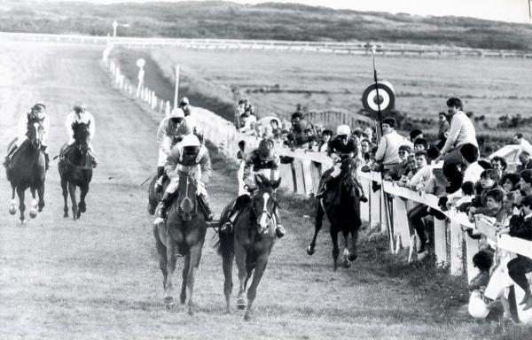 Temps. Horse Racing at Les Landes. Ref 88/2152B 39 (Possibly 86/) 
3 and a quarter mile race
David Cuthbert (front right) on 'Lasting Hope' and Michelle Cuthbert far left on 'Harlow's Boy'